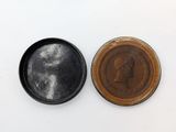 an image of a penny and a coin on a white surface