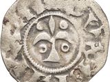 a close up of a coin with a face on it
