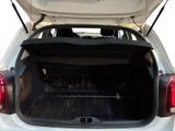 the back of a white car with its trunk open and the back of it ' s trunk open