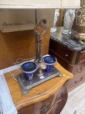 a tray with blue cups on it sitting on a dresser
