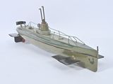 a model of a small boat on a white surface