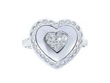 bague en or blanc sertie d'un diamant en forme de cœur