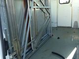 a white van with a metal frame in the back of it