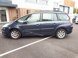 a small blue car parked in a parking lot