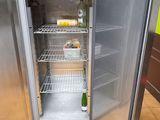 a refrigerator with a bottle of wine inside of it