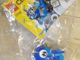 a bag of legos sitting on a table with a bag of legos