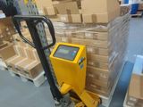 a forklift with boxes on it in a warehouse