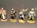seven figurines of different types of soldiers on a table