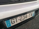 a close up of a license plate on a car