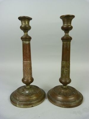 pair of antique brass candlesticks with etched designs