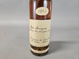 a bottle of wine that is sitting on a table