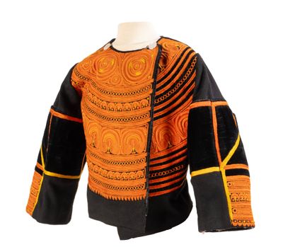 an orange and black jacket on a mannequin mannequin mannequin mannequin mannequin mannequin mannequin mannequin mann