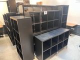 many black cabinets in a room with a table