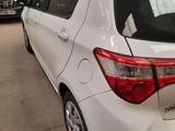 a white car that is parked in a garage