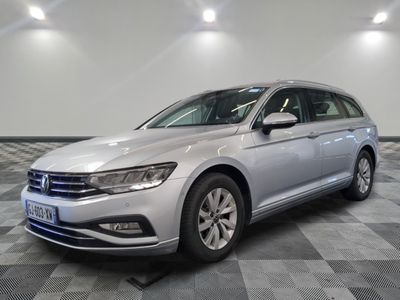 the volkswagen passat is parked in a large room with a checkered floor