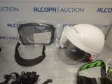a helmet, goggles, and other items on the table