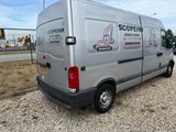 a silver van that is parked on the side of the road