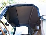 a view of the inside of a car from the driver ' s seat