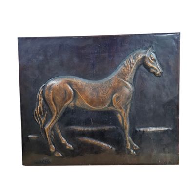 a picture of a bronze horse on a black background