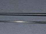 two swords that are laying next to each other on a table