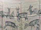 an image of a table cloth with deers on it