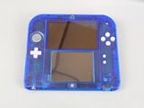 a blue nintendo wii game console sitting on a table