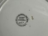 a white plate with a black and white design on it