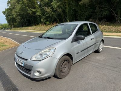 a silver car that is parked on the side of the road