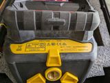 a yellow and black machine that is sitting on the floor