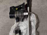 a small blow dryer sitting on a rock next to a microphone