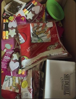 a box full of candy and other candy items