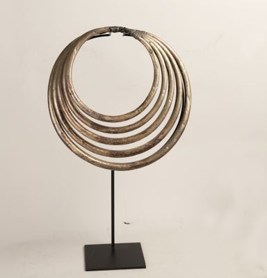 a close up of a metal object with rings on a stand