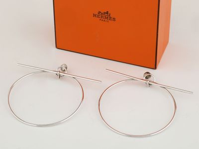 the pair of hoop earrings are in a gift box with the box in the background