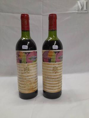 two bottles of wine sitting next to each other on a table