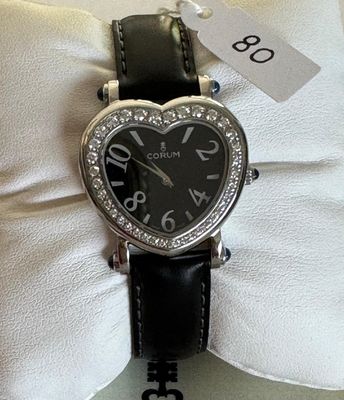 Montre en acier, signée - CORUM - HEART - 30mm X 34mm - Lune…