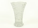 a glass vase that is sitting on a white surface