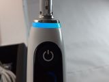 an electric toothbrush that is sitting on a table