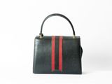 a black and red handbag on a white background