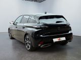 a picture of a black car in a showroom