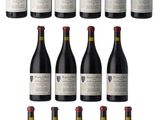a bunch of bottles of wine sitting next to each other
