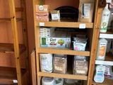 a wooden shelf with a lot of cleaning products on it