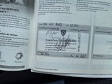 a book with a picture of a man driving a car