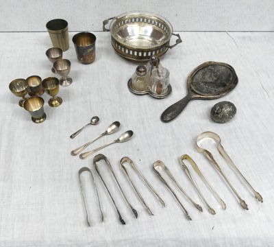 a lot of silverware on a table with spoons and spoons