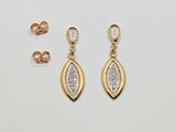 a pair of gold and diamond earrings