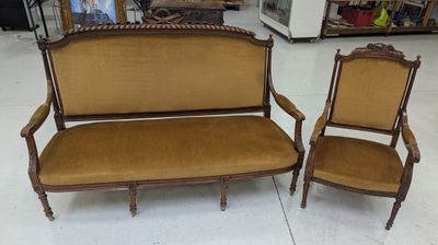 two chairs and a couch in a room with a lot of furniture
