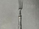 a fork and a knife sitting on a table