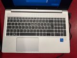 a laptop computer that is sitting on a red table
