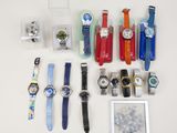 a lot of watches that are sitting on a table