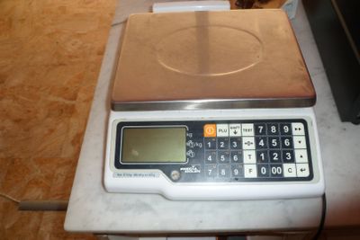 a scale with a calculator on top of it
