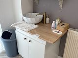 a bathroom with a sink and a radiator in it